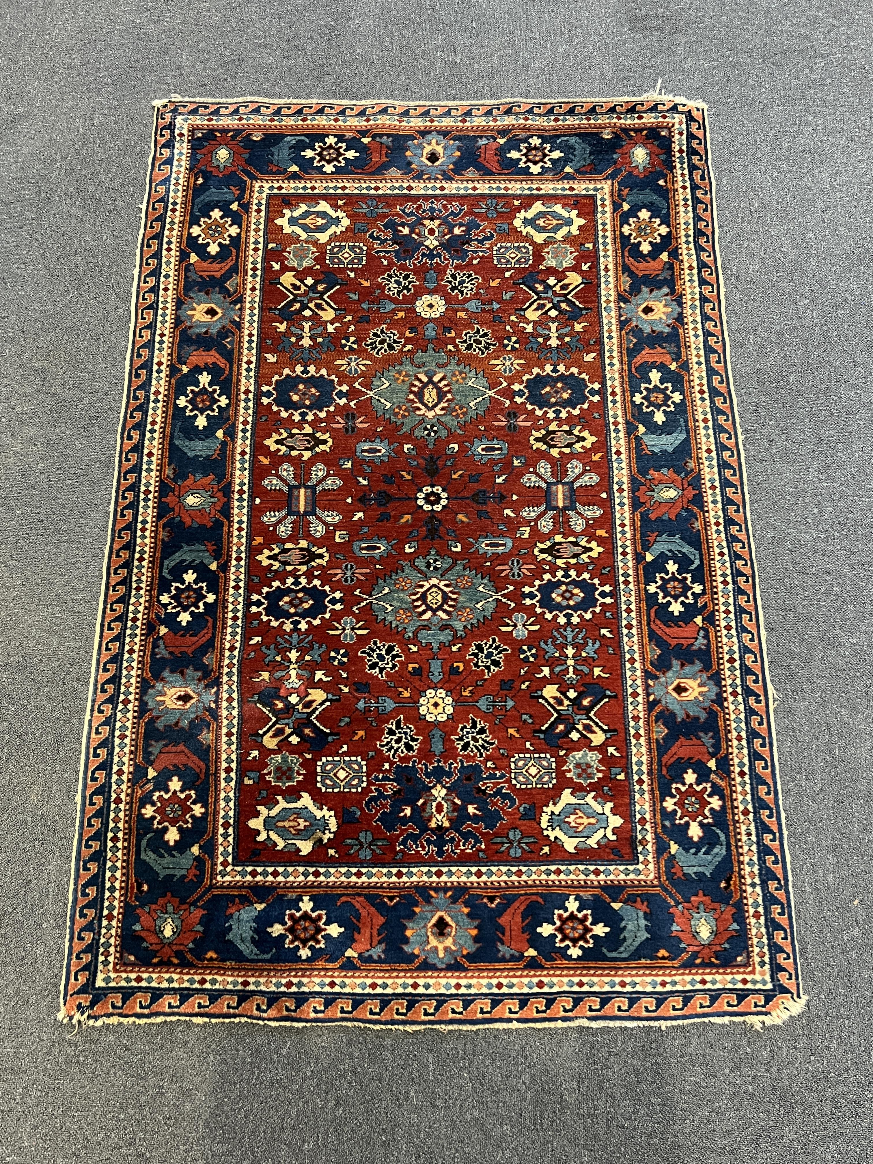 A Shiraz rug, the red field, 153 x 98cm